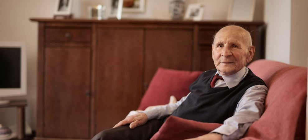 Older man sitting in an armchair