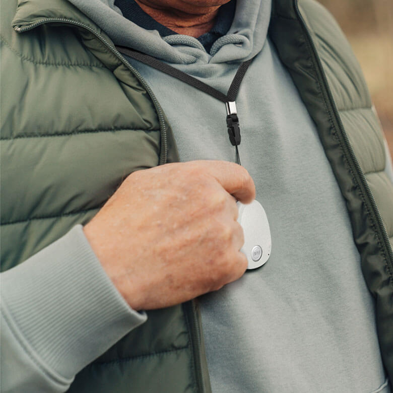 Man Pressing Alarm GPS Pendant