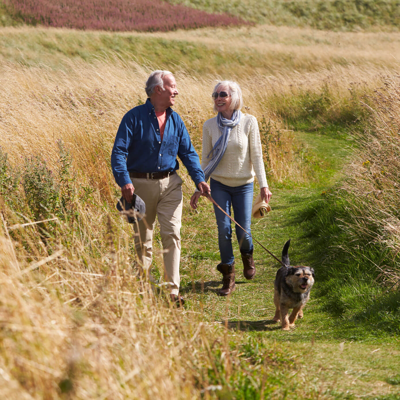Lady and Man walking with dog