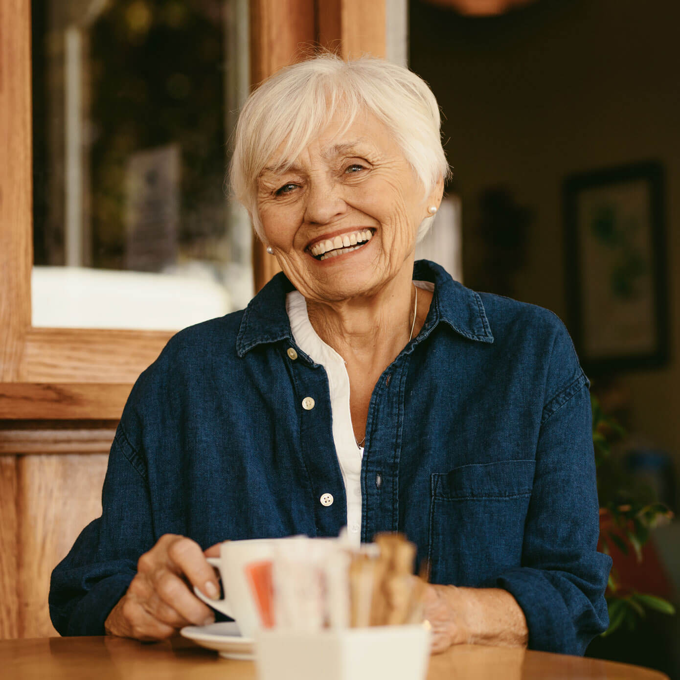 Lady enjoying a drink in a cafe