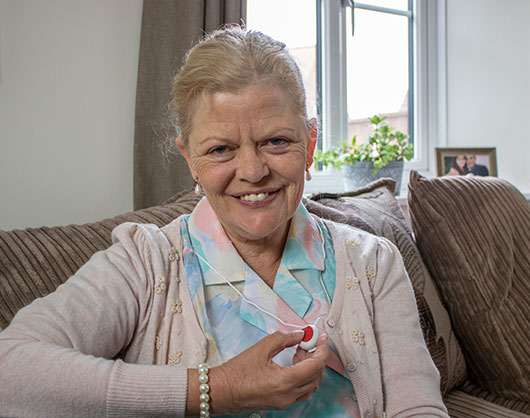 Elderly lady wearing her Careline Pendant