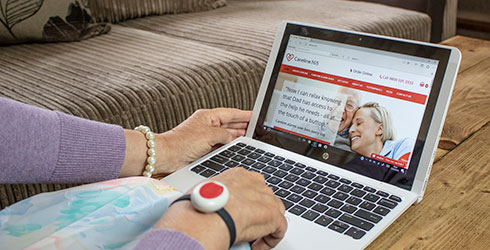 Elderly lady on her laptop looking at the Careline website